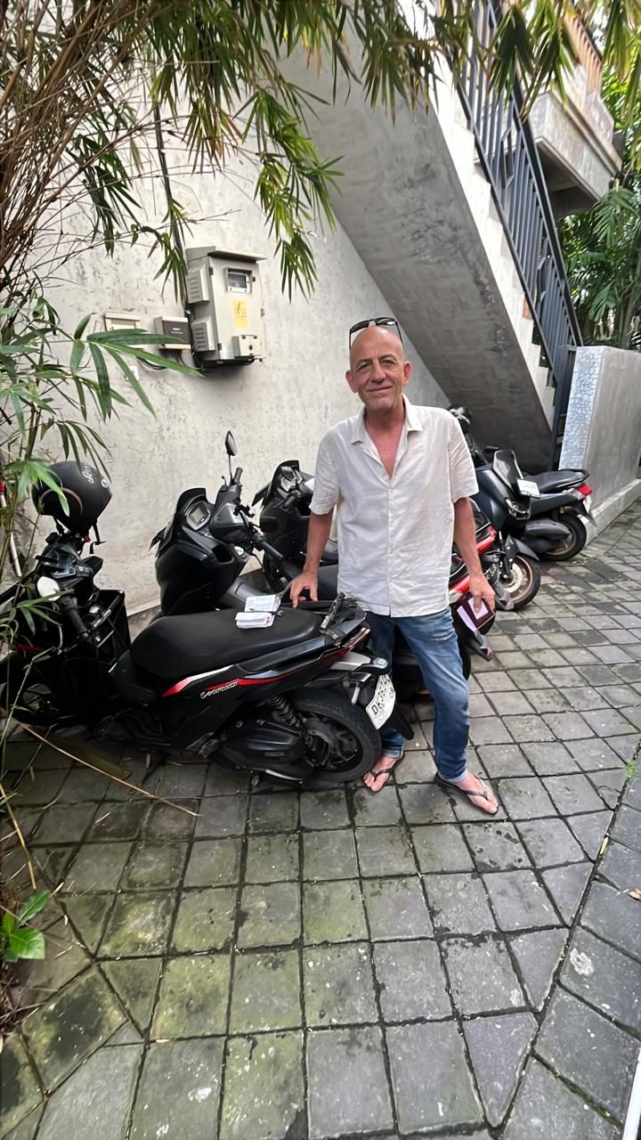Customer picking up a scooter